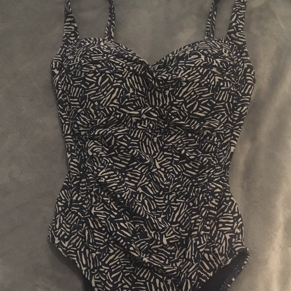 Nip tuck one piece bathing suit